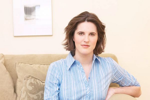 Woman sitting on brown couch.jpg