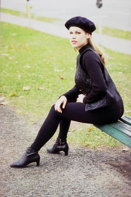 Woman sitting on corner of bench.jpg