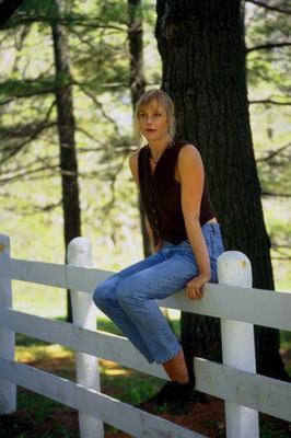 Woman sitting on white fence.jpg