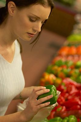 Woman squeezing green pepper.jpg