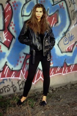 Woman standing against graffiti.jpg