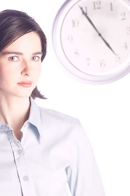 Woman standing in front of clock 2.jpg