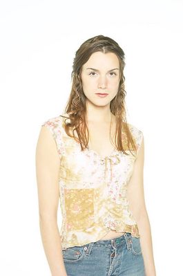 Woman standing in jeans and floral top.jpg