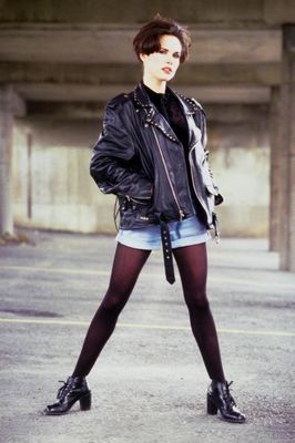 Woman standing in leather jacket.jpg