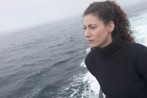 Woman standing on edge of boat.jpg