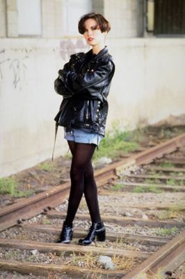 Woman standing on railroad tracks.jpg