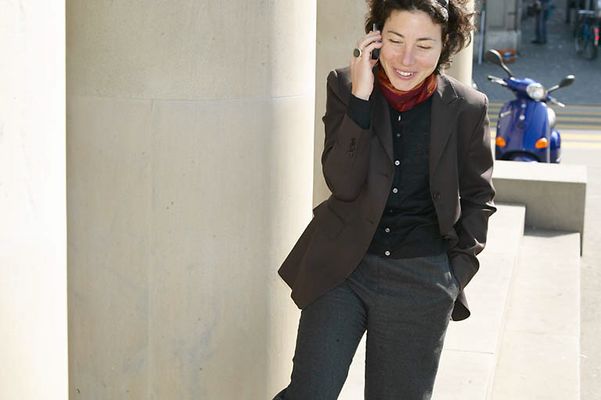 Woman standing outside talking on her cell phone uid 1455099.jpg