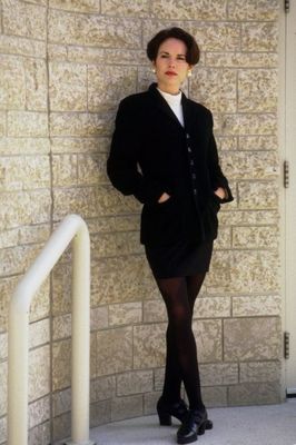 Woman standing with hands in pockets.jpg
