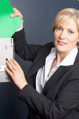 Woman taking file out of cabinet drawer.jpg