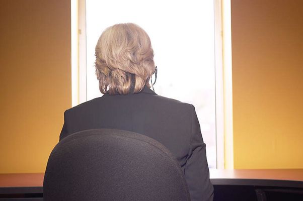 Woman talking on headset from behind uid 1280831.jpg