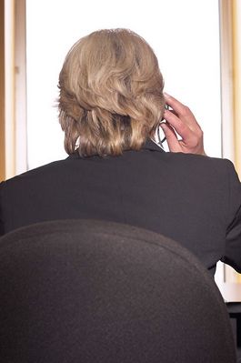 Woman talking on headset from behind.jpg