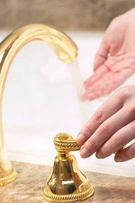 Woman testing bath water temperature 2.jpg
