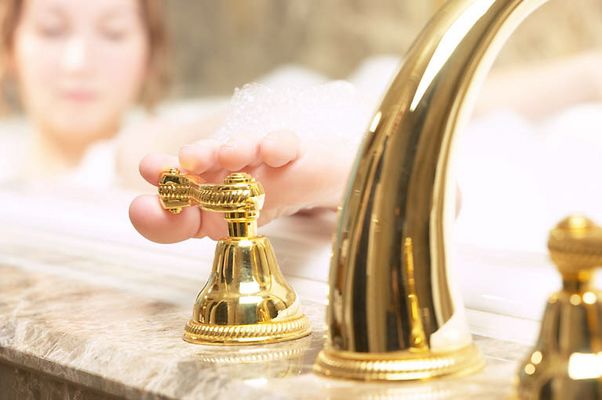 Woman turning off faucet with her toes 1.jpg