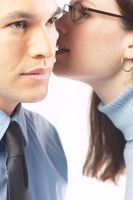 Woman whispering secret into man ear 2.jpg