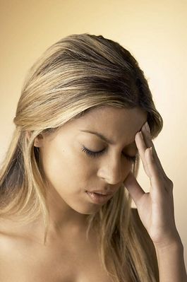 Woman with a headache uid 1284154.jpg
