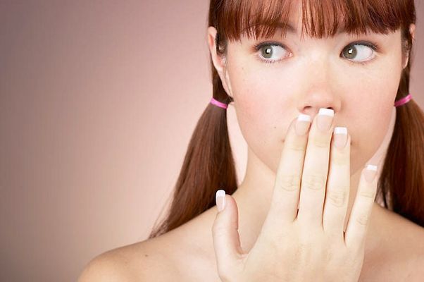 Woman with bare shoulders looking surprised.jpg