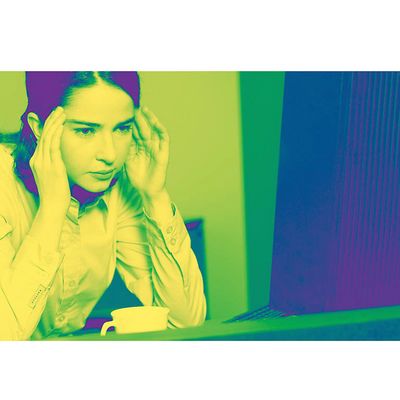 Woman with headache in green light.jpg