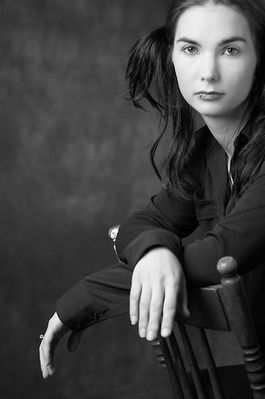 Woman with lip ring sitting in wooden chair 4.jpg