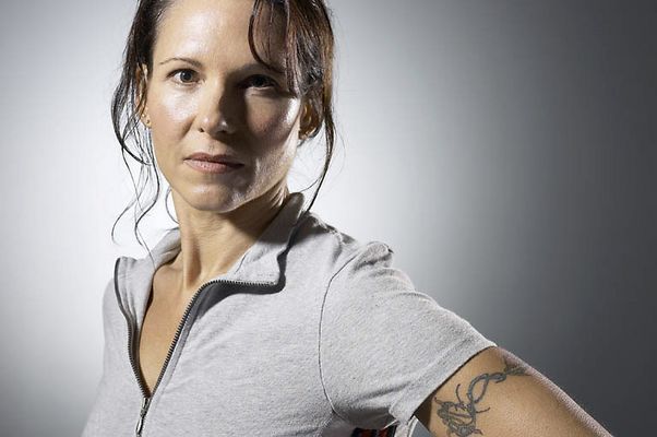 Woman with tattooed arm uid 1283809.jpg