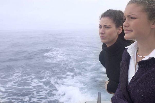 Women leaning over edge of boat.jpg