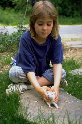 Young girl in blue with white lab rat.jpg