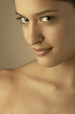 Young woman in close up smiling seductively.jpg