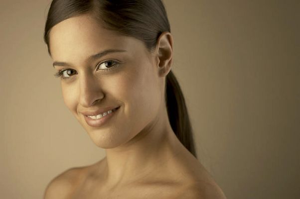 Young woman smiling and looking out.jpg