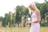 Blonde woman walking in a field uid 1284856.jpg