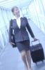 Blur of businesswoman pulling suitcase.jpg