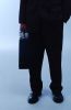 Businessman in black suit with briefcase.jpg