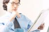 Businessman reading newspaper 2 c103129.jpg
