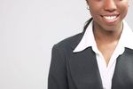 Businesswoman in black suit with white collar c102987.jpg