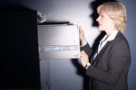 Businesswoman opening safe.jpg