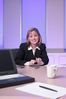 Caucasian businesswoman at board table during job interview.jpg