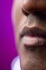 Close up of South Asian man lips against purple background 1.jpg