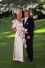 Couple standing by flowers.jpg
