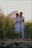 Couple standing near tall grass.jpg