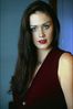 Dark haired woman in ruby vest.jpg
