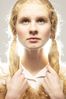 Light shining behind woman with her hair in braids.jpg