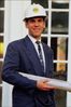 Man in suit with blueprints.jpg