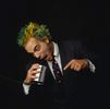 Man yelling into a tin cup.jpg
