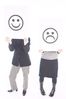 People holding up happy and sad face signs.jpg