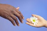 Person offering flower 0001.jpg