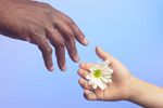 Person offering flower 0002.jpg