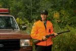 Ranger in orange jacket with gun.jpg