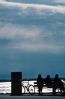 Silhouette of people city on bench along seashore 1.jpg