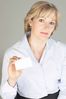 Smiling businesswoman holding out business card uid 1280860.jpg