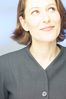 Smiling businesswoman looking upwards.jpg