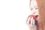 Woman biting tomato uid 1343059.jpg