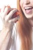Woman eating tomato uid 1343069.jpg